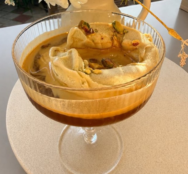 Colato pistachio affogato. Gelato floating in freshly pulled espresso